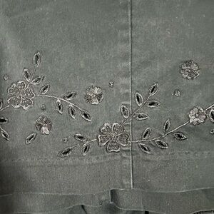 Women’s black capris with beautiful flower embroidery at the bottom of both legs